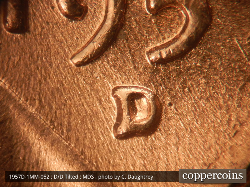 Die-stage B marker on 1957D•1MM•052 (1957 Repunched Mint Mark).