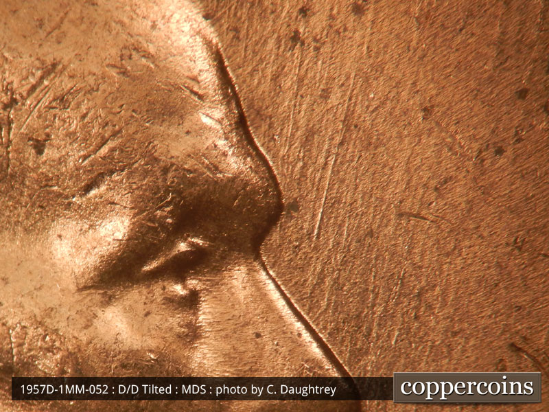 Die-stage B marker on 1957D•1MM•052 (1957 Repunched Mint Mark).