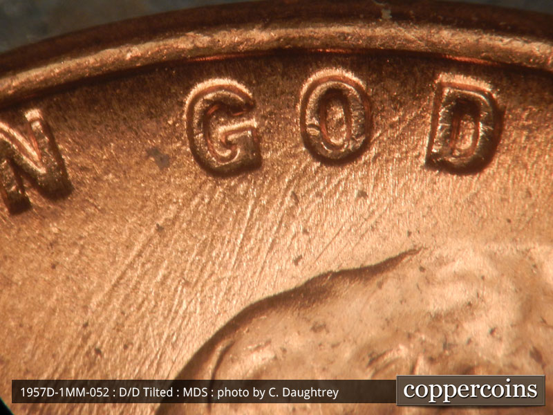 Die-stage B marker on 1957D•1MM•052 (1957 Repunched Mint Mark).