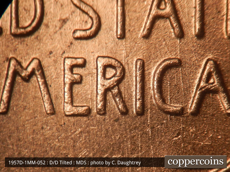 Die-stage B marker on 1957D•1MM•052 (1957 Repunched Mint Mark).
