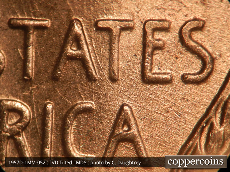 Die-stage B marker on 1957D•1MM•052 (1957 Repunched Mint Mark).
