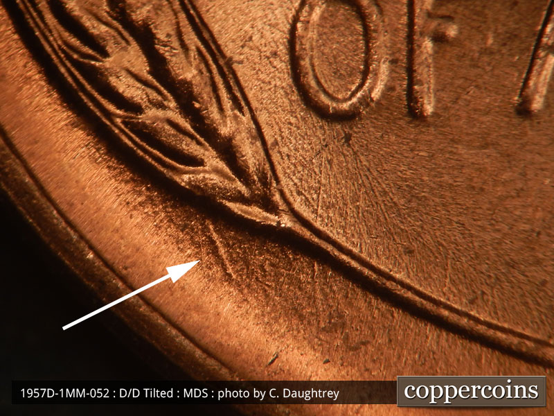Die-stage B marker on 1957D•1MM•052 (1957 Repunched Mint Mark).