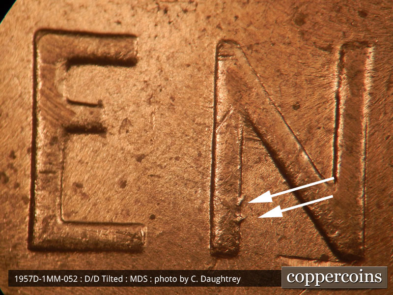 Die-stage B marker on 1957D•1MM•052 (1957 Repunched Mint Mark).