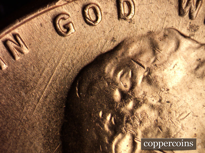Die-stage B marker on 1957D•1MM•053 (1957 Repunched Mint Mark).
