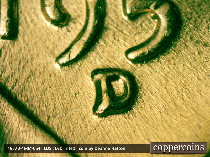 Die-stage C marker on 1957D•1MM•054 (1957 Repunched Mint Mark).