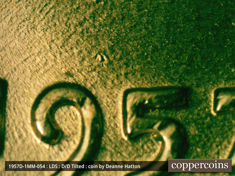 Die-stage C marker on 1957D•1MM•054 (1957 Repunched Mint Mark).
