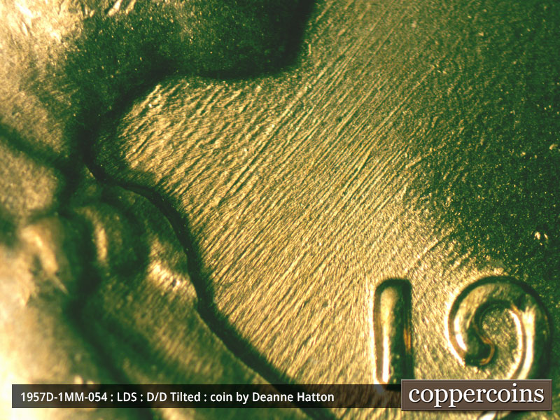 Die-stage C marker on 1957D•1MM•054 (1957 Repunched Mint Mark).