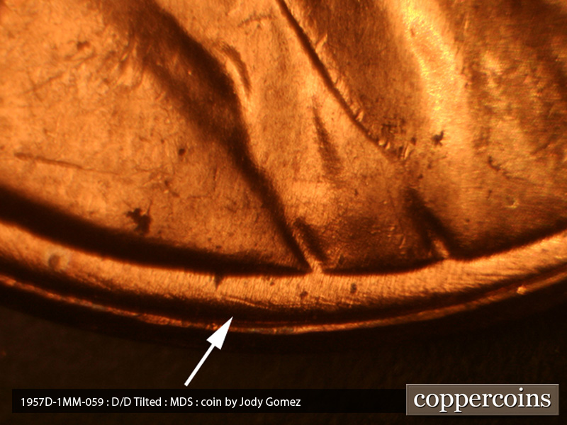 Die-stage B marker on 1957D•1MM•059 (1957 Repunched Mint Mark).