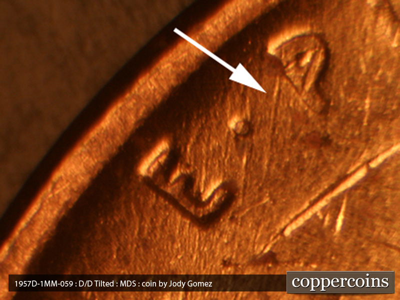 Die-stage B marker on 1957D•1MM•059 (1957 Repunched Mint Mark).