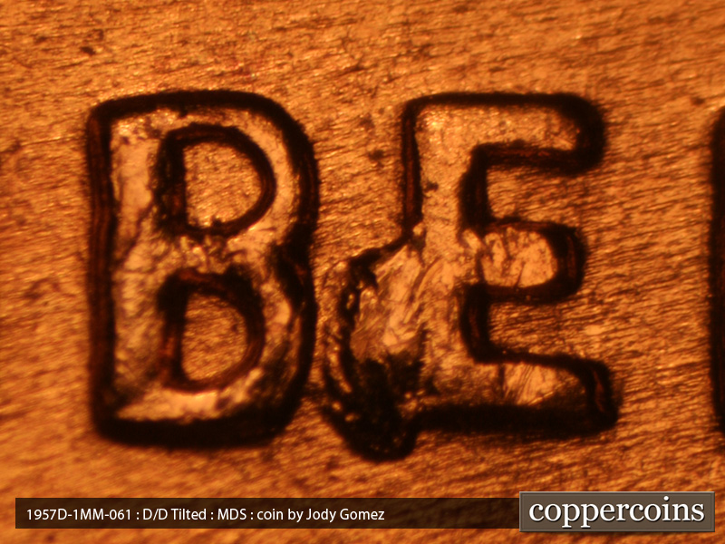 Die-stage B marker on 1957D•1MM•061 (1957 Repunched Mint Mark).