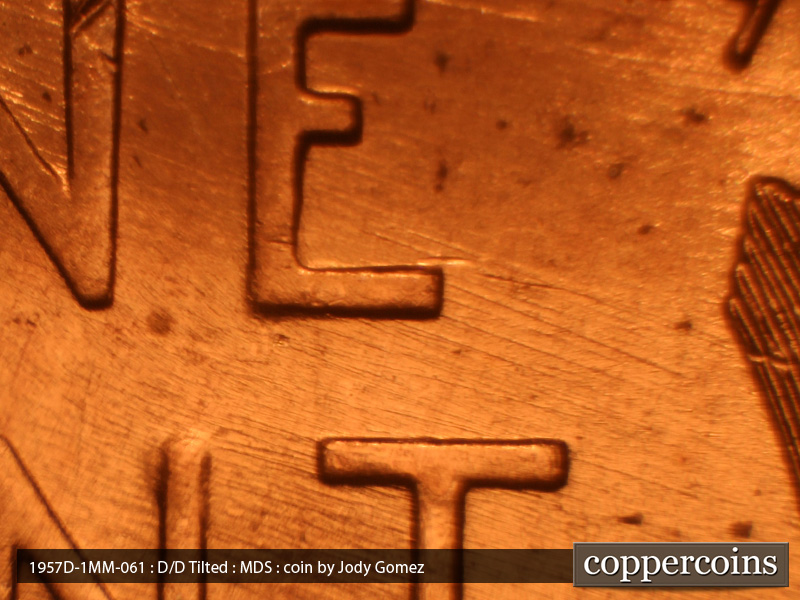 Die-stage B marker on 1957D•1MM•061 (1957 Repunched Mint Mark).