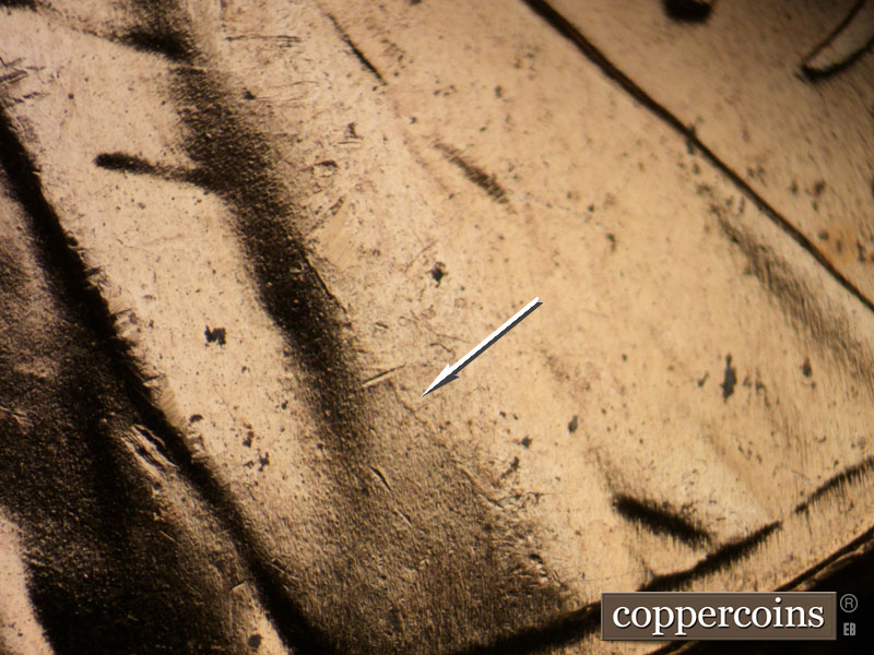 Die-stage B marker on 1957D•1MM•065 (1957 Repunched Mint Mark).