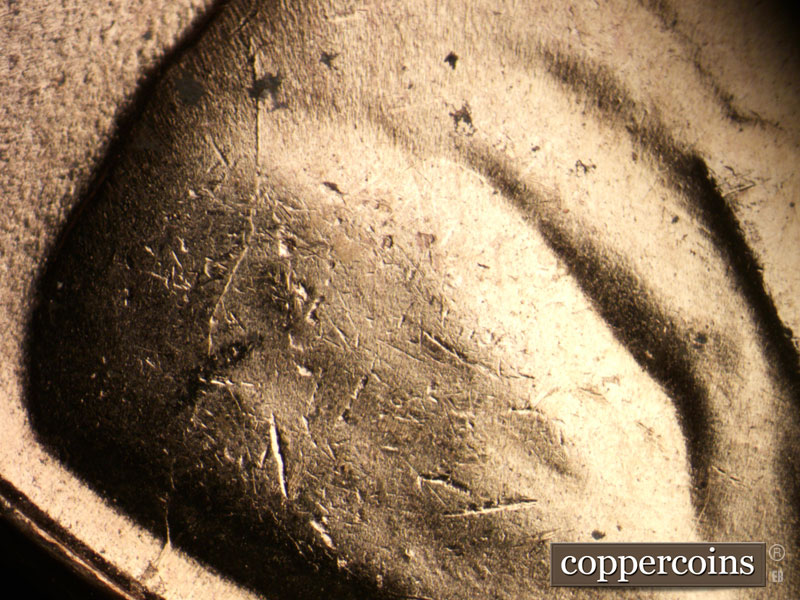 Die-stage B marker on 1957D•1MM•065 (1957 Repunched Mint Mark).