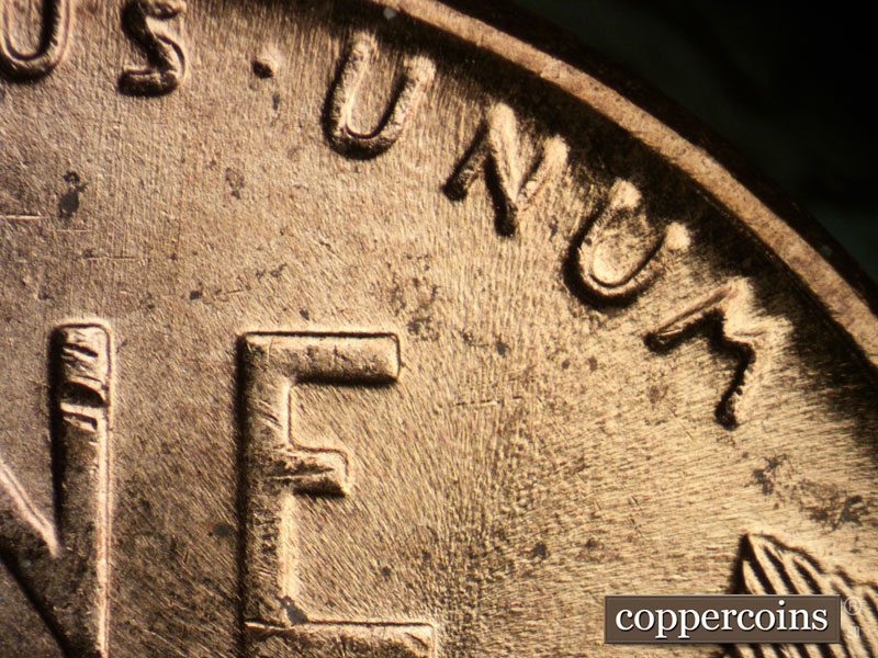 Die-stage B marker on 1957D•1MM•065 (1957 Repunched Mint Mark).