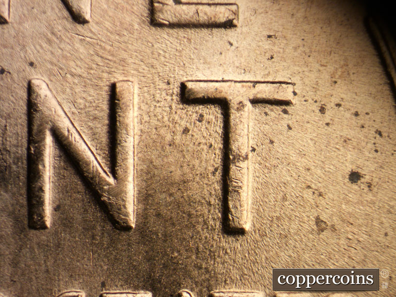 Die-stage B marker on 1957D•1MM•065 (1957 Repunched Mint Mark).