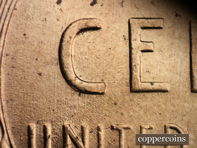 Die-stage B marker on 1957D•1MM•065 (1957 Repunched Mint Mark).