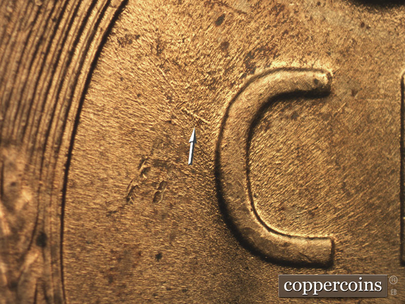 Die-stage B marker on 1957D•1MM•066 (1957 Repunched Mint Mark).