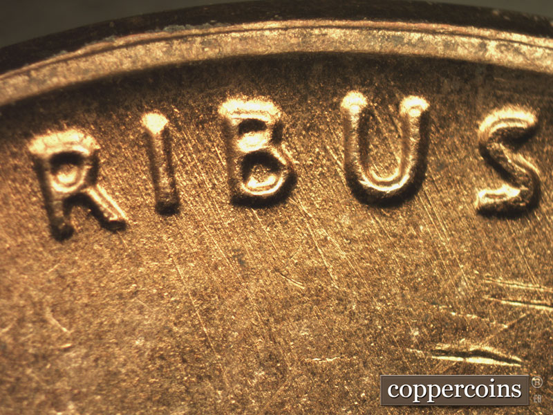 Die-stage B marker on 1957D•1MM•067 (1957 Repunched Mint Mark).