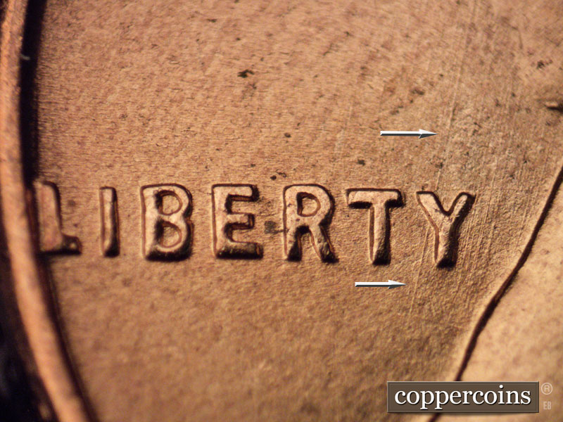 Die-stage B marker on 1957D•1MM•068 (1957 Repunched Mint Mark).