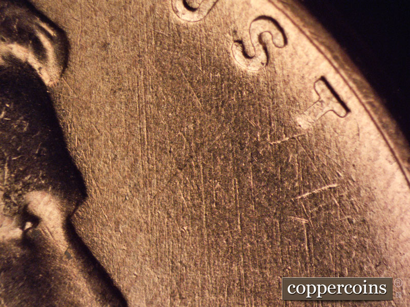 Die-stage B marker on 1957D•1MM•068 (1957 Repunched Mint Mark).