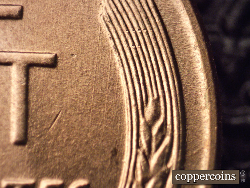 Die-stage B marker on 1957D•1MM•068 (1957 Repunched Mint Mark).