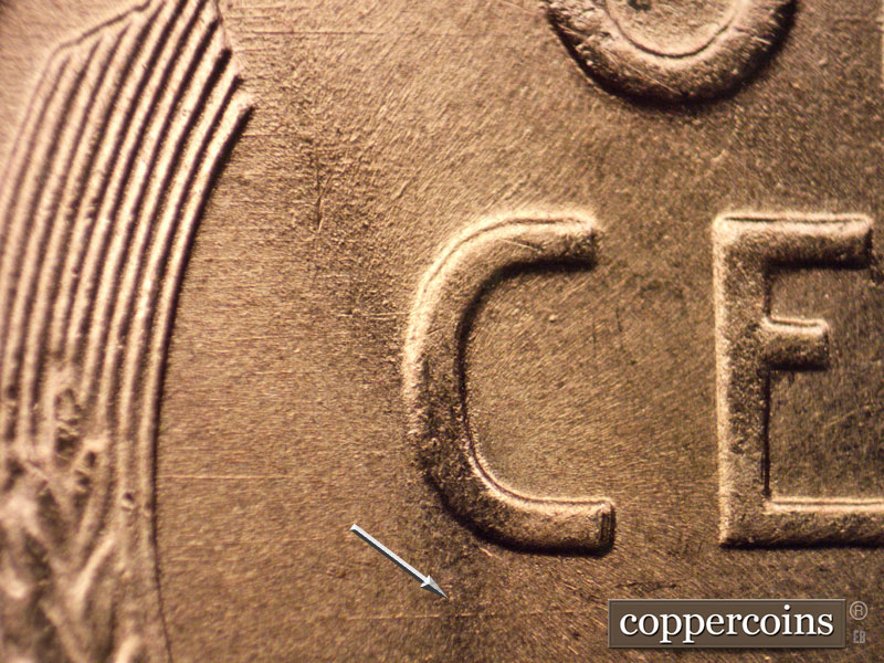 Die-stage B marker on 1957D•1MM•068 (1957 Repunched Mint Mark).