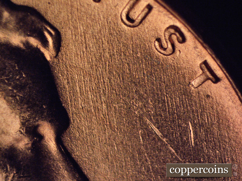 Die-stage B marker on 1957D•1MM•069 (1957 Repunched Mint Mark).