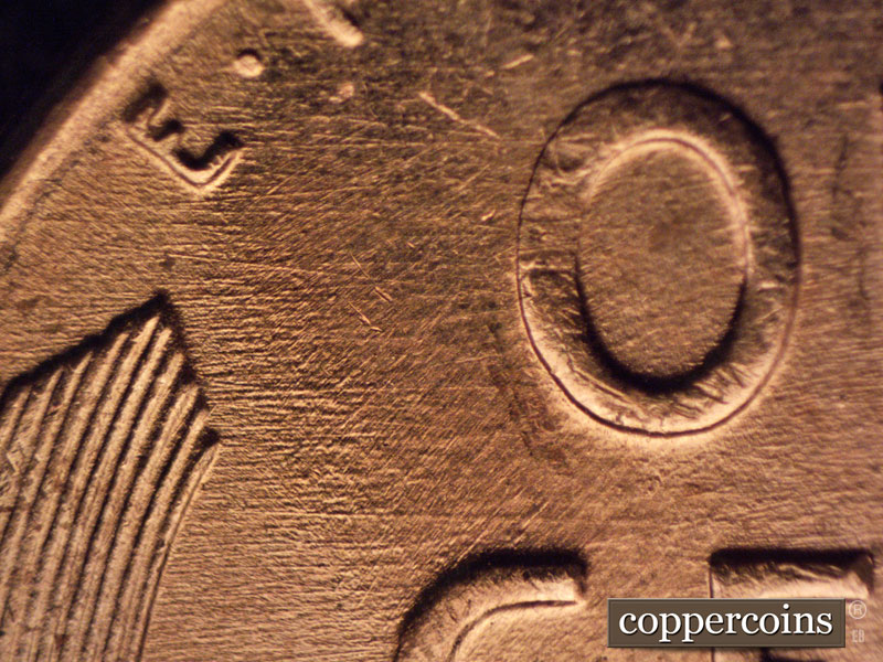 Die-stage B marker on 1957D•1MM•069 (1957 Repunched Mint Mark).