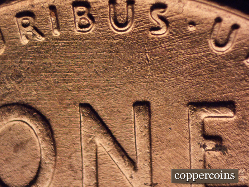 Die-stage B marker on 1957D•1MM•069 (1957 Repunched Mint Mark).