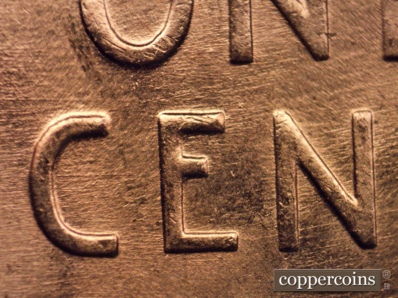 Die-stage B marker on 1957D•1MM•069 (1957 Repunched Mint Mark).