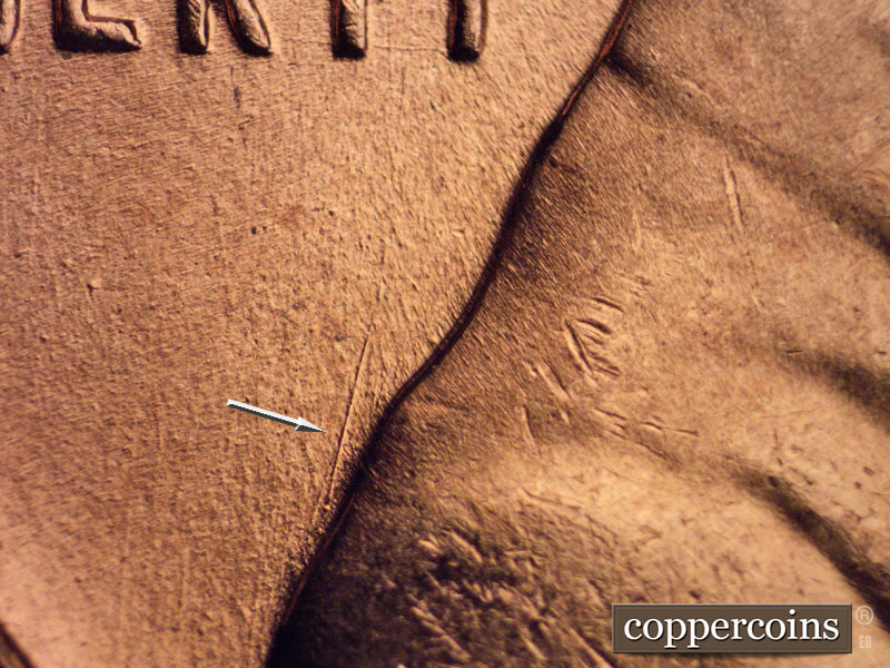 Die-stage B marker on 1957D•1MM•070 (1957 Repunched Mint Mark).