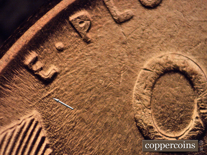 Die-stage B marker on 1957D•1MM•070 (1957 Repunched Mint Mark).