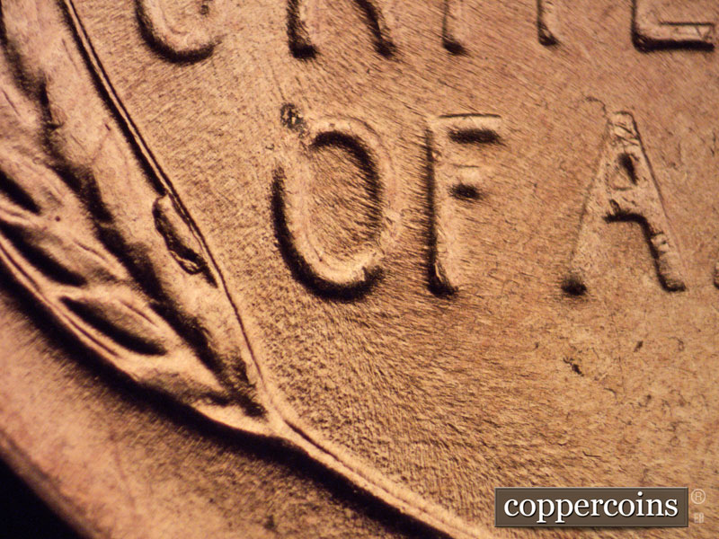 Die-stage B marker on 1957D•1MM•070 (1957 Repunched Mint Mark).