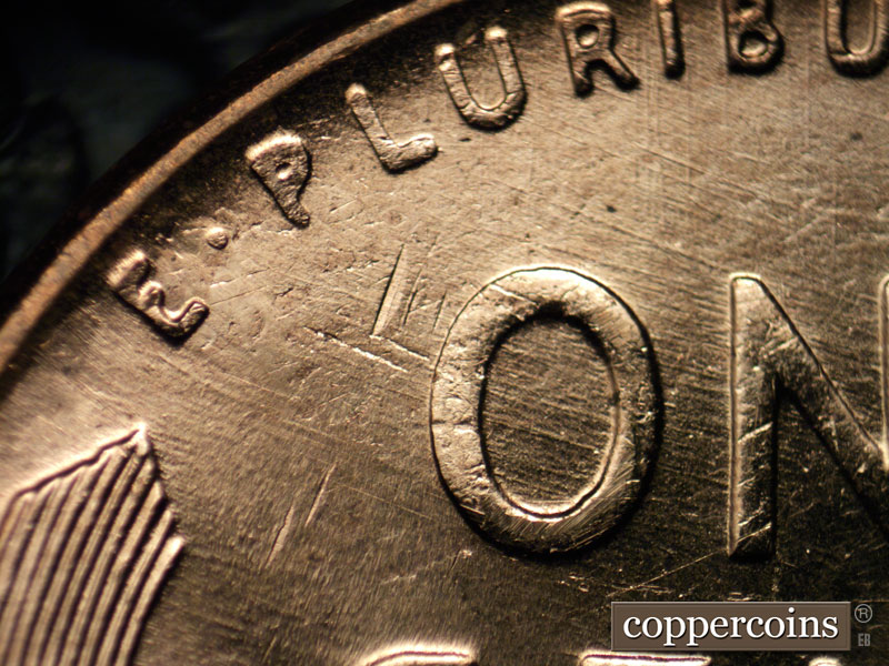 Die-stage B marker on 1957D•1MM•071 (1957 Repunched Mint Mark).