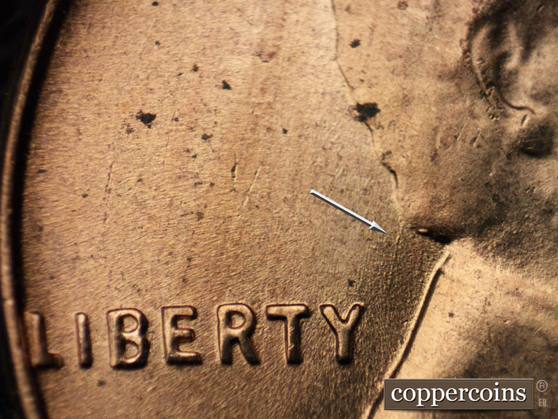 Die-stage B marker on 1957D•1MM•074 (1957 Repunched Mint Mark).