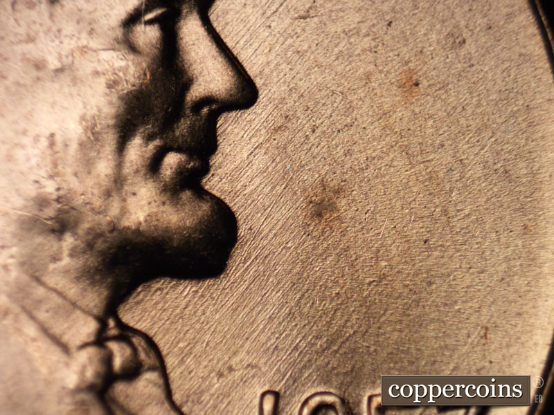 Die-stage B marker on 1957D•1MM•075 (1957 Repunched Mint Mark).