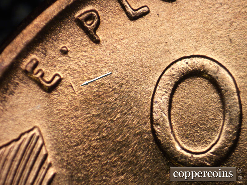 Die-stage B marker on 1957D•1MM•077 (1957 Repunched Mint Mark).