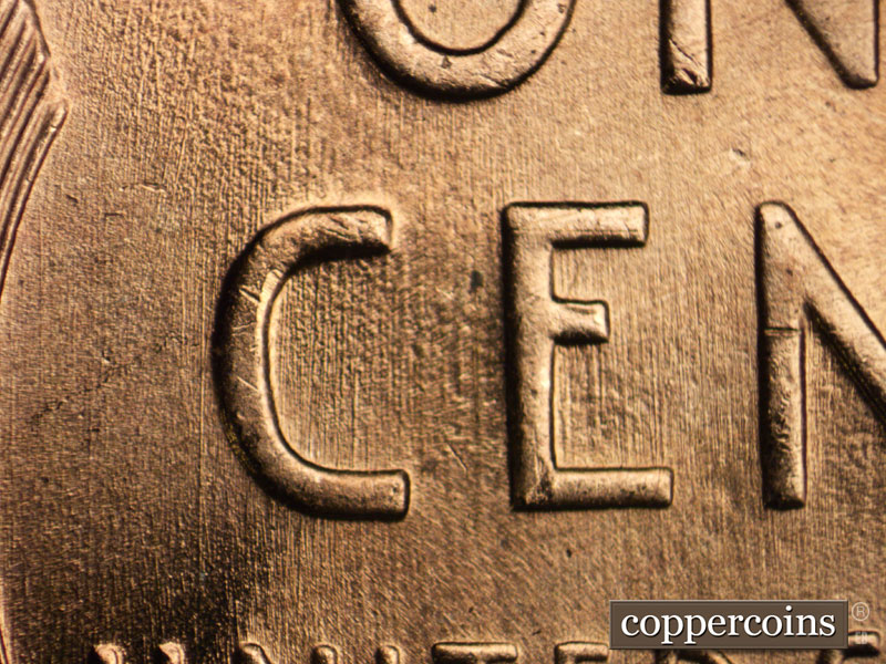 Die-stage B marker on 1957D•1MM•077 (1957 Repunched Mint Mark).
