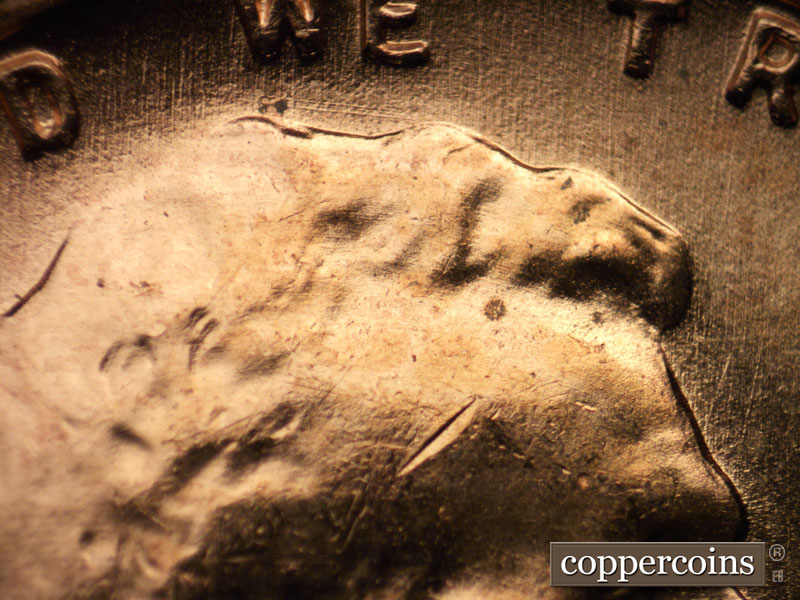 Die-stage B marker on 1957D•1MM•082 (1957 Repunched Mint Mark).