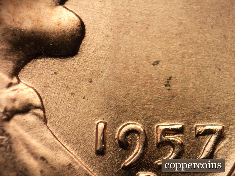 Die-stage B marker on 1957D•1MM•082 (1957 Repunched Mint Mark).