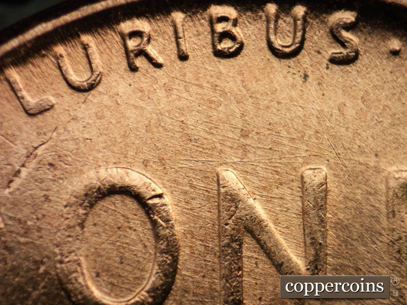 Die-stage B marker on 1957D•1MM•082 (1957 Repunched Mint Mark).