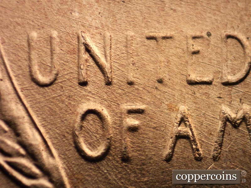 Die-stage B marker on 1957D•1MM•082 (1957 Repunched Mint Mark).