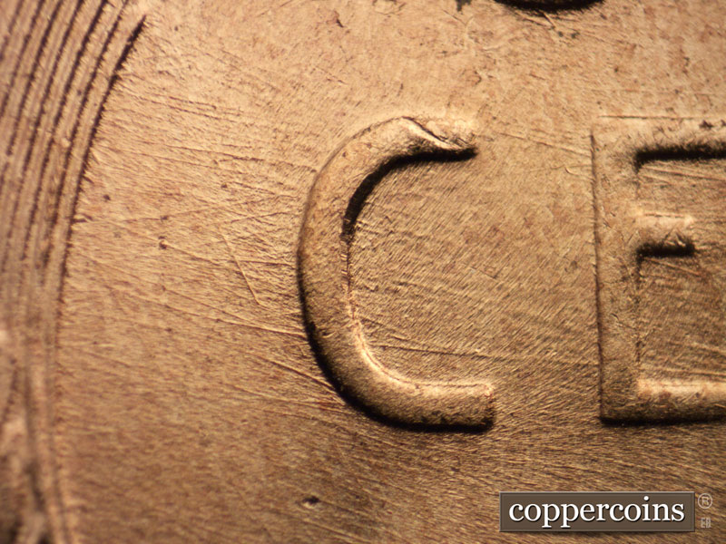Die-stage B marker on 1957D•1MM•082 (1957 Repunched Mint Mark).