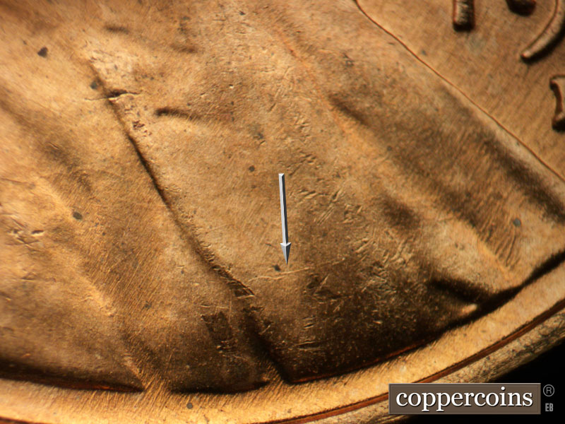 Die-stage B marker on 1957D•1MM•086 (1957 Repunched Mint Mark).