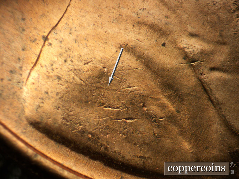 Die-stage B marker on 1957D•1MM•086 (1957 Repunched Mint Mark).