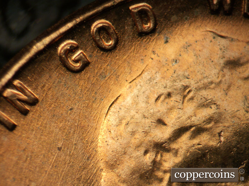 Die-stage B marker on 1957D•1MM•086 (1957 Repunched Mint Mark).