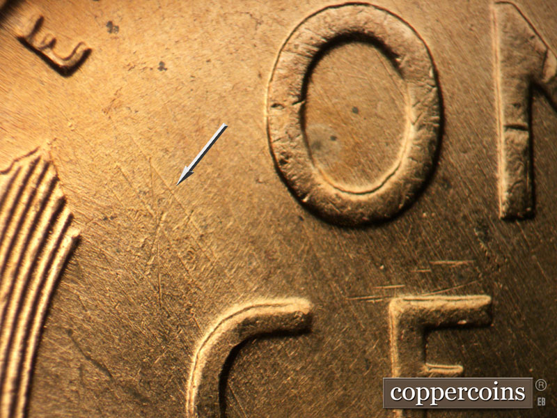 Die-stage B marker on 1957D•1MM•086 (1957 Repunched Mint Mark).