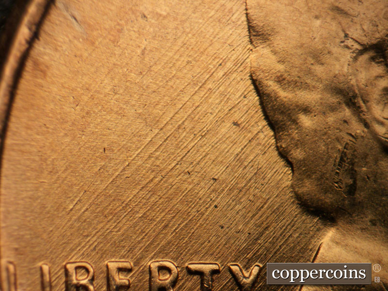 Die-stage B marker on 1957D•1MM•087 (1957 Repunched Mint Mark).
