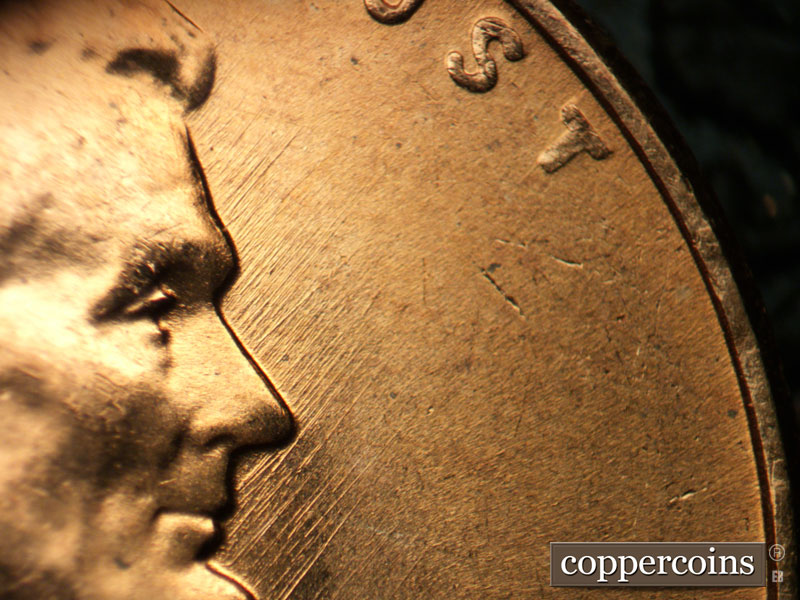 Die-stage B marker on 1957D•1MM•087 (1957 Repunched Mint Mark).