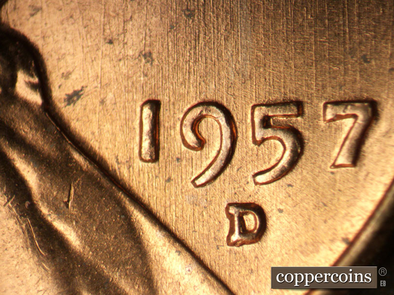 Die-stage B marker on 1957D•1MM•093 showing N/S die scratches through date and mint mark.